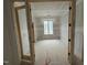 Unfinished bedroom with window and doorframe in new home under construction at 3405 Makers Circle, Raleigh, NC 27612