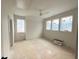 Spacious bedroom with three large windows and a ceiling fan, offering plenty of natural light and air circulation at 3405 Makers Circle, Raleigh, NC 27612