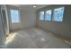 Bright bedroom offers great natural light from its many windows and a ceiling fan for added comfort at 3405 Makers Circle, Raleigh, NC 27612