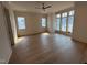 Bright bedroom with hardwood floors and multiple windows offering plenty of natural light at 3405 Makers Circle, Raleigh, NC 27612