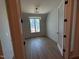 Bedroom with new floors, neutral paint, and a double window that provides lots of natural light at 3405 Makers Circle, Raleigh, NC 27612