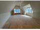 Large bonus room offers great natural light from its many windows with interesting architectural details at 3405 Makers Circle, Raleigh, NC 27612