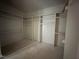 Bright, spacious walk-in closet with shelving offering ample storage; awaiting final touches at 3405 Makers Circle, Raleigh, NC 27612