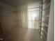 Empty walk-in closet featuring installed storage shelving for clothing and organization at 3405 Makers Circle, Raleigh, NC 27612