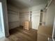 Walk-in closet with custom shelving and hardwood floors at 3405 Makers Circle, Raleigh, NC 27612