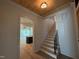 The foyer features wooden ceilings, hardwood floors, and a staircase to the second floor at 3405 Makers Circle, Raleigh, NC 27612
