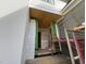 Covered front porch with wood ceiling and stairs under construction at 3405 Makers Circle, Raleigh, NC 27612