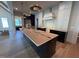 This spacious kitchen features white subway tile and a large kitchen island at 3405 Makers Circle, Raleigh, NC 27612