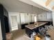 Spacious kitchen with black cabinets, white subway tile backsplash, and modern pendant lighting at 3405 Makers Circle, Raleigh, NC 27612