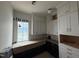 Bright kitchen featuring white and black cabinets, subway tile backsplash, and lots of natural light at 3405 Makers Circle, Raleigh, NC 27612