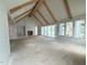 Open-concept living room showcasing a fireplace, recessed lighting and access to outdoor living space at 3405 Makers Circle, Raleigh, NC 27612