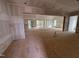 Open living room featuring large windows, ready for finishing touches and personalization at 3405 Makers Circle, Raleigh, NC 27612