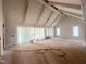 Spacious living room with vaulted ceiling, exposed beams and large sliding glass doors for lots of natural light at 3405 Makers Circle, Raleigh, NC 27612