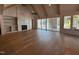 The living room boasts wood floors, high ceilings, a marble fireplace, and lots of light at 3405 Makers Circle, Raleigh, NC 27612