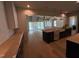 Open-concept living space boasts hardwood floors, modern lighting, and a view to the backyard at 3405 Makers Circle, Raleigh, NC 27612