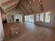 Spacious living room featuring hardwood floors, high ceilings, and a stone fireplace at 3405 Makers Circle, Raleigh, NC 27612