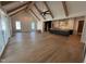 Open-concept living room flows into kitchen with hardwood floors and vaulted ceilings at 3405 Makers Circle, Raleigh, NC 27612