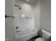 Newly tiled shower and tub with white subway tile and modern fixtures offers a spa-like experience at 3405 Makers Circle, Raleigh, NC 27612