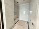 New tile shower stall in construction stage, with a built-in seat at 3405 Makers Circle, Raleigh, NC 27612