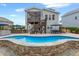 Spacious backyard with pool, outdoor bar, and elevated deck, ideal for outdoor living at 3548 Willow Green Dr, Apex, NC 27502