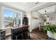 Charming bar area with a wine rack, stools, and a large window showcasing the neighborhood at 3548 Willow Green Dr, Apex, NC 27502