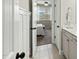 En-suite bathroom leading from main bedroom, and a view of the bedroom at 3548 Willow Green Dr, Apex, NC 27502