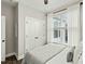 Bright bedroom with a window dressed in white curtains and a closet with double doors at 3548 Willow Green Dr, Apex, NC 27502