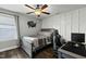 Inviting bedroom with desk, ceiling fan, and unique wall decor at 3548 Willow Green Dr, Apex, NC 27502