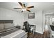 Bedroom features a ceiling fan, wood-look floors, and a desk at 3548 Willow Green Dr, Apex, NC 27502