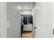 Walk-in closet features built-in shelving, hanging rods, and carpeted floor at 3548 Willow Green Dr, Apex, NC 27502