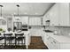 Well-equipped kitchen with stainless steel appliances, ample cabinet space and quartz countertops at 3548 Willow Green Dr, Apex, NC 27502