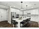 Beautiful kitchen with an oversized island, stainless steel appliances and designer light fixtures at 3548 Willow Green Dr, Apex, NC 27502