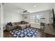 Spacious living room with stylish decor, ceiling fan, and large window at 3548 Willow Green Dr, Apex, NC 27502