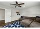 Large living room with ceiling fan, board and batten wall accents, and comfortable seating at 3548 Willow Green Dr, Apex, NC 27502