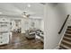 Open living room with plush seating, ceiling fan, and an adjacent dining area bathed in natural light at 3548 Willow Green Dr, Apex, NC 27502