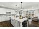 Open-concept kitchen and living room area, great for entertaining and Gathering gatherings at 3548 Willow Green Dr, Apex, NC 27502