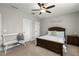 Well-lit main bedroom with a ceiling fan, and en-suite bathroom at 3548 Willow Green Dr, Apex, NC 27502