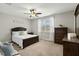 Spacious main bedroom with a ceiling fan, large window, and furnishings at 3548 Willow Green Dr, Apex, NC 27502