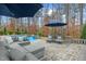 Serene pool area with comfortable lounge seating and lush landscaping, perfect for relaxation at 3548 Willow Green Dr, Apex, NC 27502