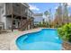 Inviting backyard with pool, deck and seating for serene enjoyment and entertaining at 3548 Willow Green Dr, Apex, NC 27502