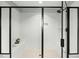 Modern tiled shower with glass door and built-in bench at 3548 Willow Green Dr, Apex, NC 27502