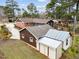 An aerial view shows the home, detached garage, and utility shed on a large lot at 412 N Cheatham St, Franklinton, NC 27525