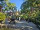 Backyard featuring stone patio, bird bath, wind chimes, flowers and other garden decor at 412 N Cheatham St, Franklinton, NC 27525