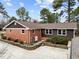 An exterior elevation shows the brick and siding exterior and new roof of this home at 412 N Cheatham St, Franklinton, NC 27525