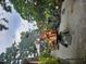 Fire pit in backyard featuring stone patio, bird bath, wind chimes, flowers and other decor at 412 N Cheatham St, Franklinton, NC 27525