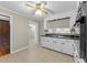 This kitchen has black countertops, white cabinets, and stainless steel appliances at 412 N Cheatham St, Franklinton, NC 27525