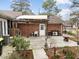 Back patio featuring brick siding, a covered pergola, and a concrete patio at 412 N Cheatham St, Franklinton, NC 27525