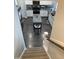 Spacious kitchen with stainless steel appliances, granite countertops and center island seen from the stairs at 433 Falling Brook Dr, Kenly, NC 27542