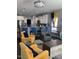 Inviting living room with an open layout, pendant lighting, bar seating, and comfortable seating arrangements at 433 Falling Brook Dr, Kenly, NC 27542