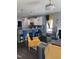 Open living room with modern pendant lights, a breakfast bar, and comfortable armchairs at 433 Falling Brook Dr, Kenly, NC 27542